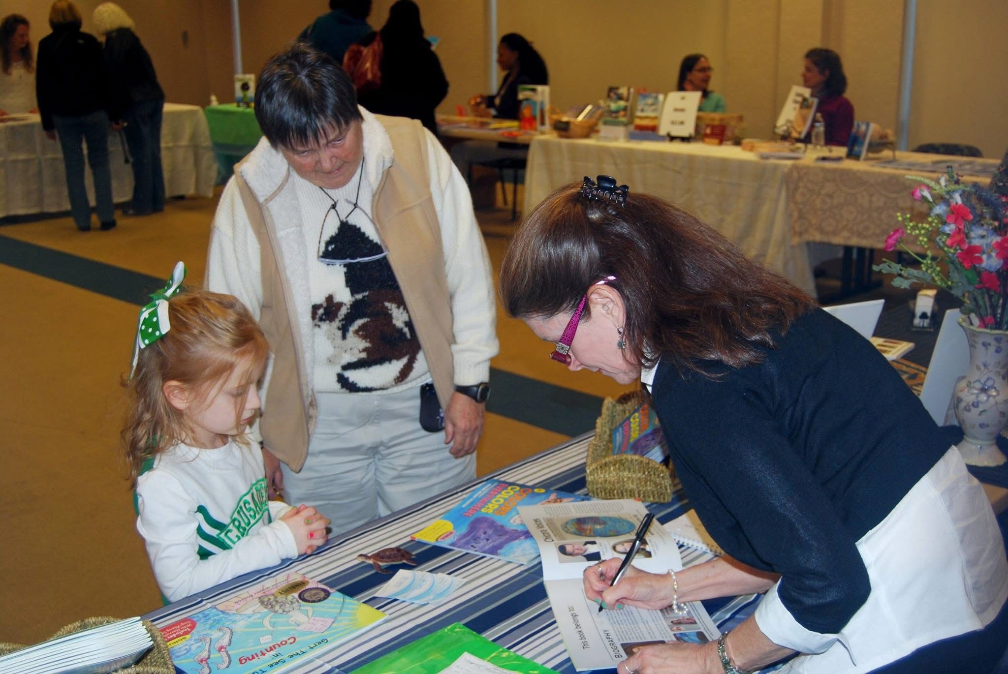 Maxine Moody Poston signing books